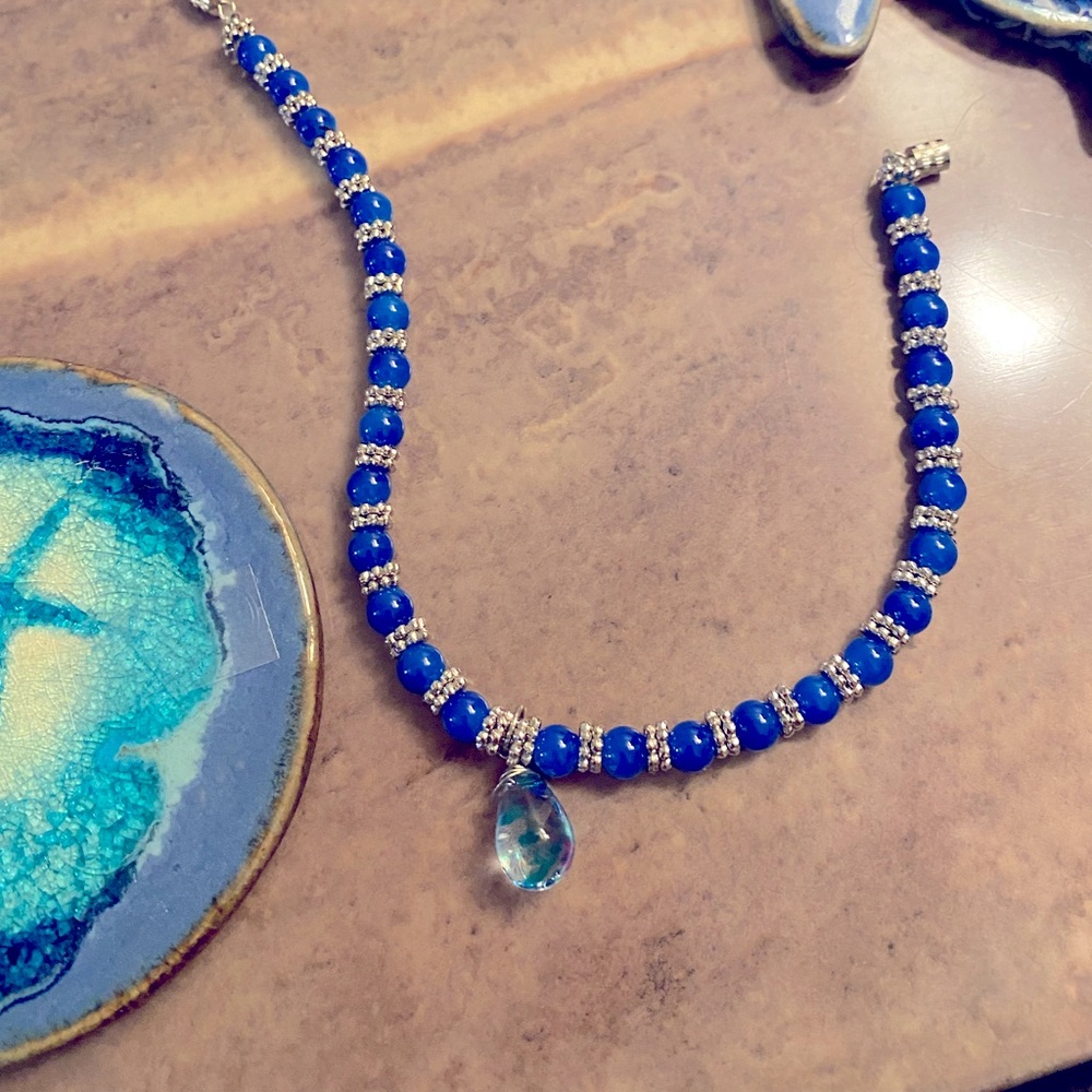 Pretty ankle bracelet. Blue & silver beads w/ a screw clasp and crystal pendant.